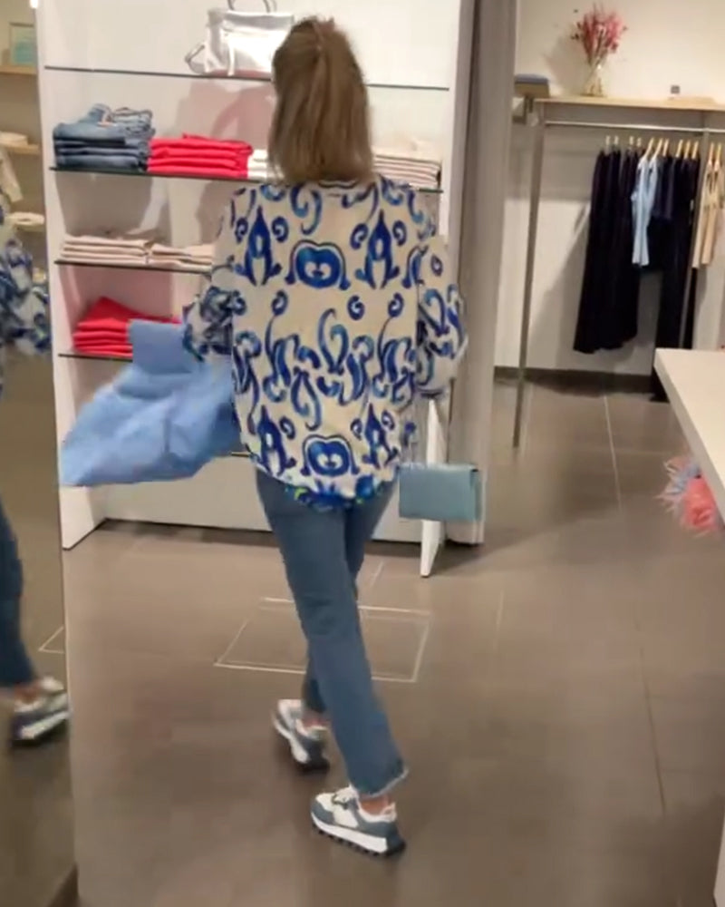 Elegant long-sleeved top with printed V-neck