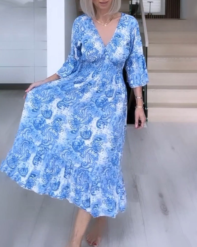 V-neck belted printed flowy dress
