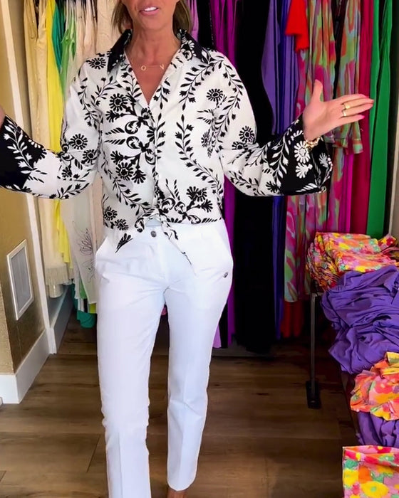 Elegant top with printed lapels and lantern sleeves