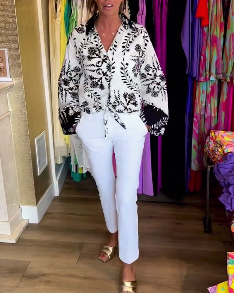 Elegant top with printed lapels and lantern sleeves