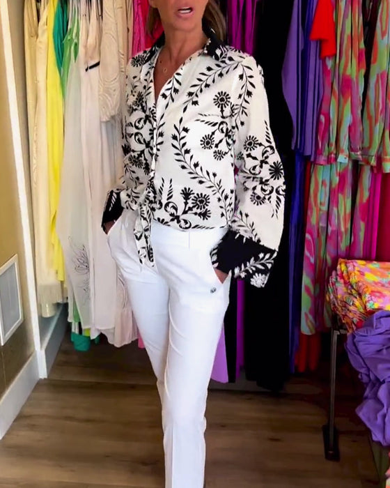 Elegant top with printed lapels and lantern sleeves