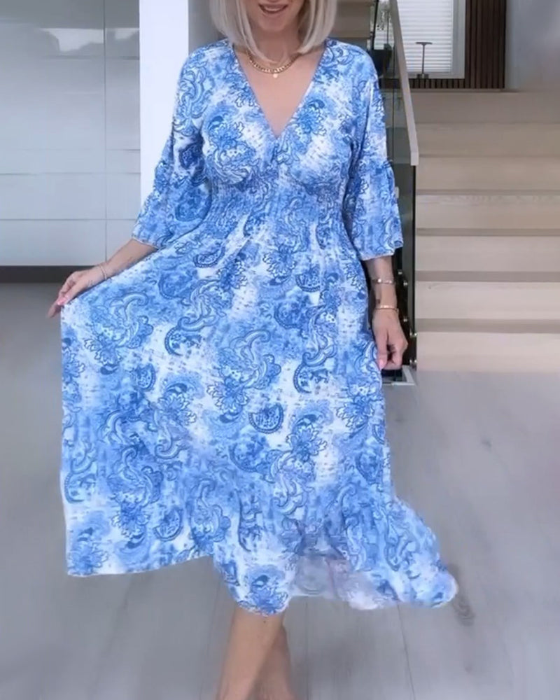 V-neck belted printed flowy dress