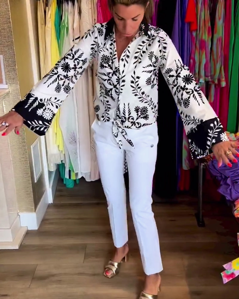 Elegant top with printed lapels and lantern sleeves