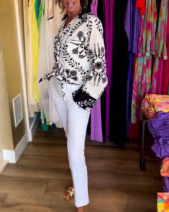 Elegant top with printed lapels and lantern sleeves