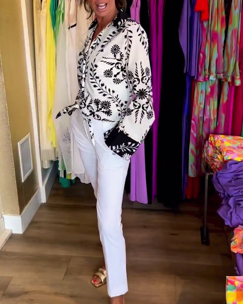 Elegant top with printed lapels and lantern sleeves