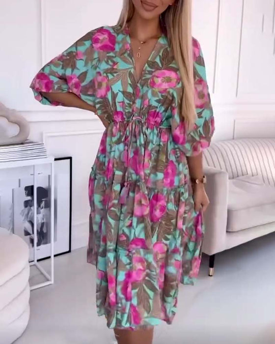 Elegant dress with drawstring ties and floral print