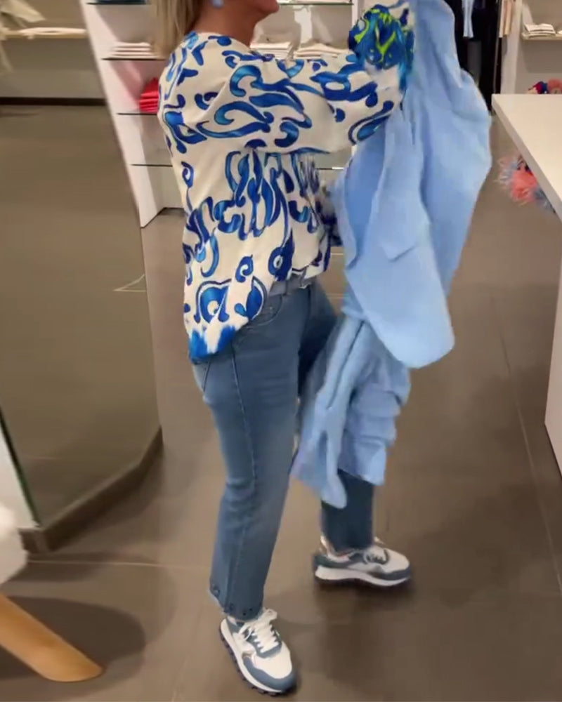 Elegant long-sleeved top with printed V-neck