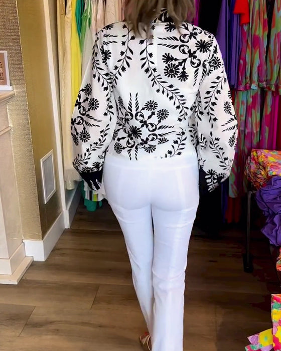 Elegant top with printed lapels and lantern sleeves