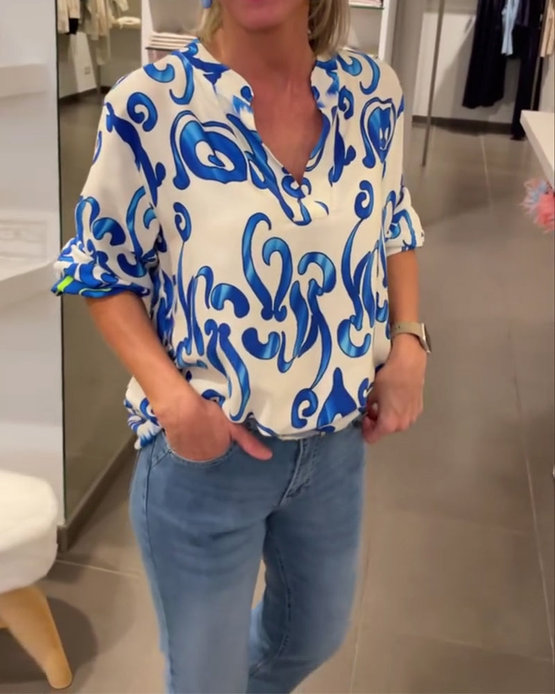 Elegant long-sleeved top with printed V-neck