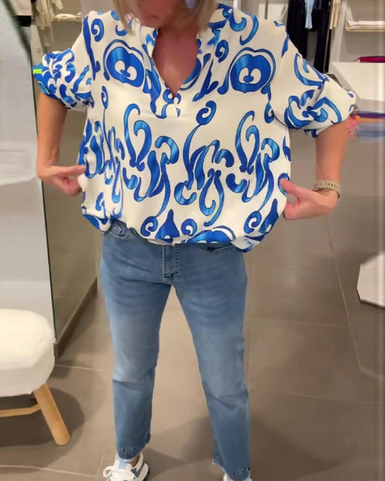 Elegant long-sleeved top with printed V-neck